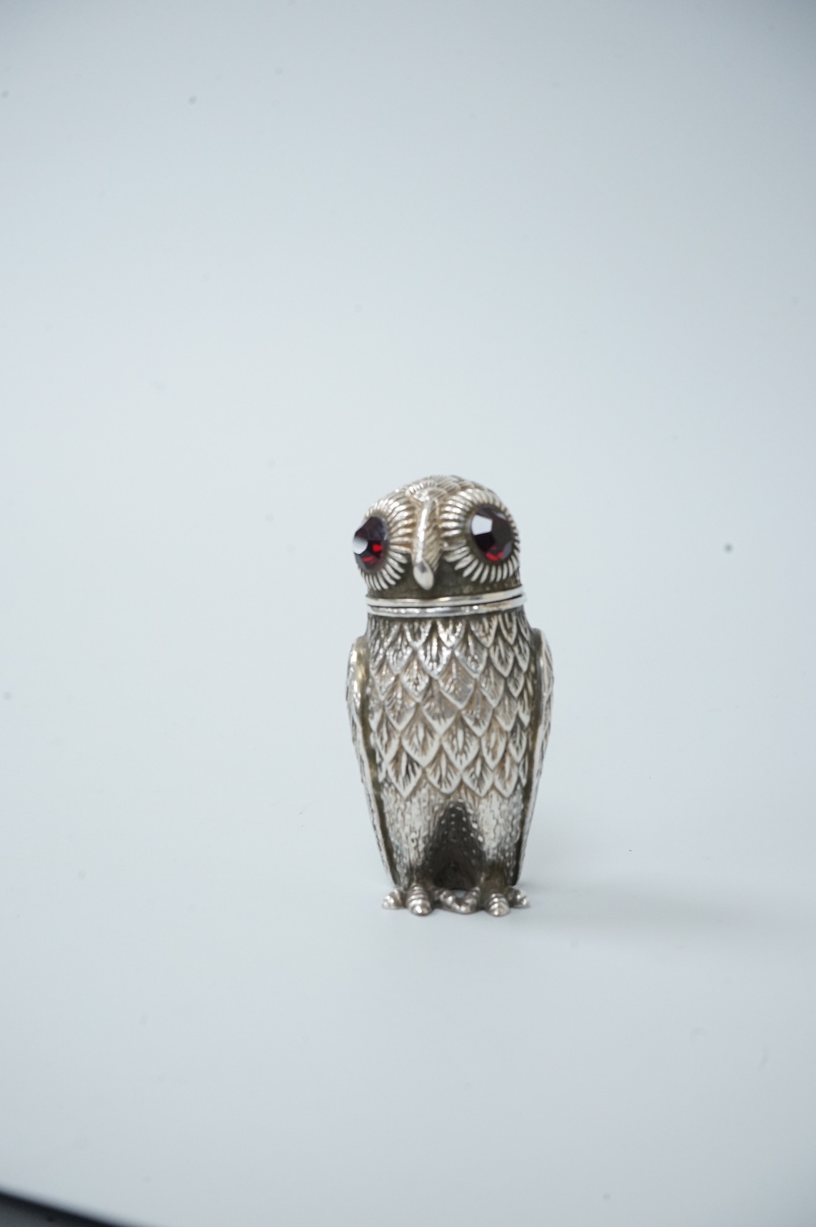 A novelty silver plated condiment, modelled as an owl, with two faceted glass eyes, height 66mm.